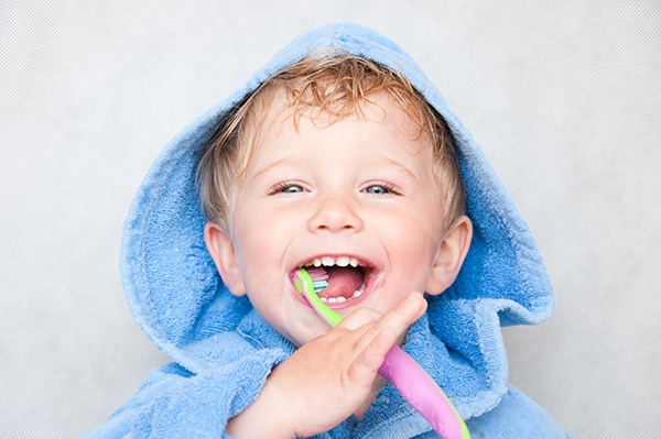 Young Boy Brushing Teeth image
