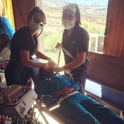 Dentist Martha Ha Treating Patient